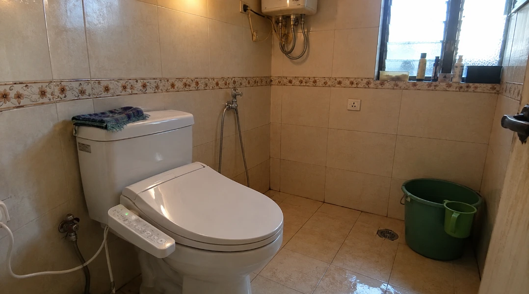 Bidet seat in a real Indian bathroom