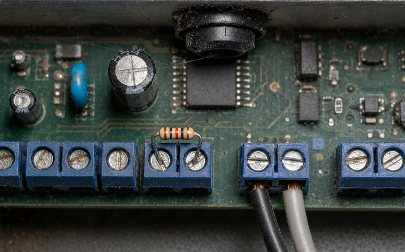 The left pair has a resistor bridged across it and nothing connected. The operator believes a sensor is there. Ask a contractor about this and watch which way they react